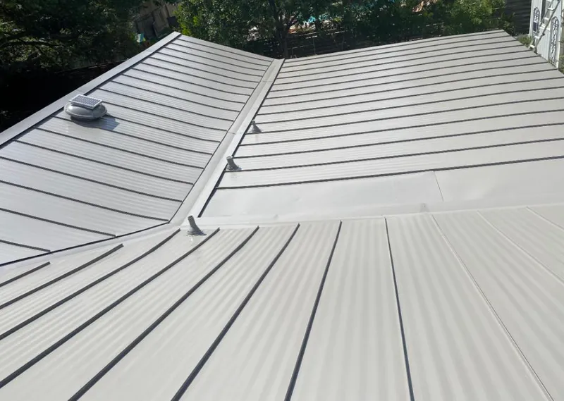 Solar attic fan installed on a metal roof for Roof Ventilation in Waipio